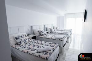 Posteľ alebo postele v izbe v ubytovaní Hostel Camino de Finisterre + 31 fotografií
