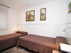 Postel nebo postele na pokoji v ubytování Apartment DMS V by Interhome