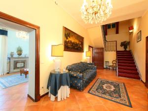 a living room with a couch and a table at Villa Paolotti by Interhome in Bettona