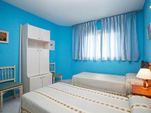 Кровать или кровати в номере Apartment DMS IV-1 by Interhome