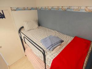 a small bedroom with a bunk bed in a room at Apartment MemLing-1 by Interhome in Vilafortuny