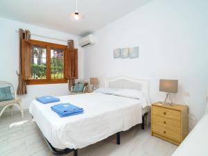 Ein Bett oder Betten in einem Zimmer der Unterkunft Holiday Home Tesoro Park by Interhome