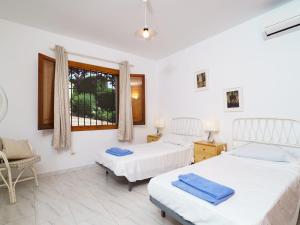 Ein Bett oder Betten in einem Zimmer der Unterkunft Holiday Home Tesoro Park by Interhome