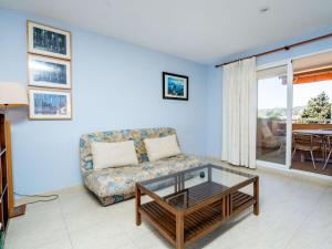 a living room with a couch and a glass coffee table at Apartment Menorca-3 by Interhome in Balcon del Mar