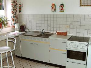 a small kitchen with a sink and a stove at Apartment Kopei by Interhome in Eschenbruch