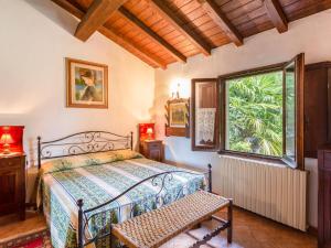 a bedroom with a bed and a window at Holiday Home Il Casale by Interhome in Molezzano