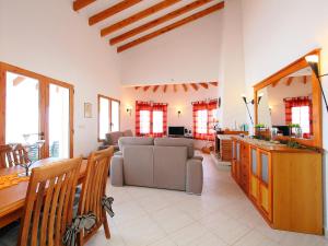 a living room with a couch and a table at Holiday Home Monte y Mar by Interhome in Monte Pego