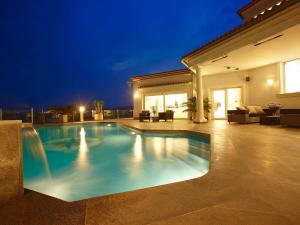 a swimming pool in a house at night at Holiday Home Finca Edel by Interhome in Cumbre del Sol