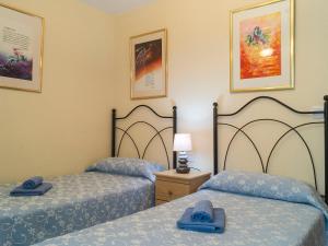a bedroom with two beds with blue towels on them at Apartment Las Terrazas by Interhome in Marbella