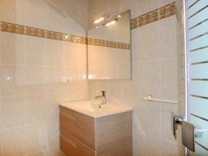 a bathroom with a sink and a mirror at Holiday Home Etxe Zuri by Interhome in Calpe