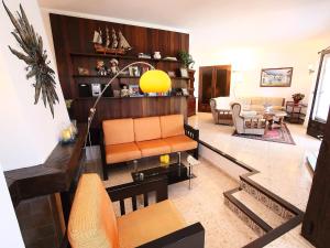 a living room with a couch and a table at Holiday Home Krumel by Interhome in Moraira