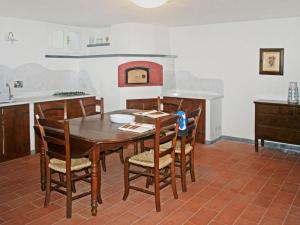 a kitchen with a table and chairs in a room at Villa Marzia by Interhome in Forte dei Marmi