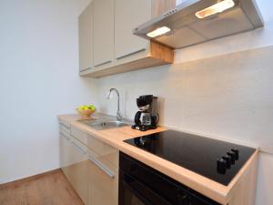 a kitchen with a sink and a coffee maker at Apartment Kika-1 by Interhome in Ližnjan