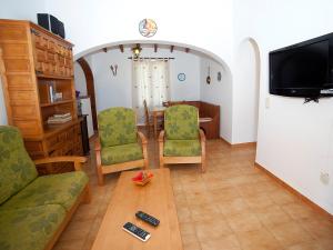 a living room with a couch and a table at Holiday Home Heidi by Interhome in Empedrola