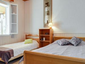 a bedroom with two beds and a window at Holiday Home Remember by Interhome in Mimizan-Plage