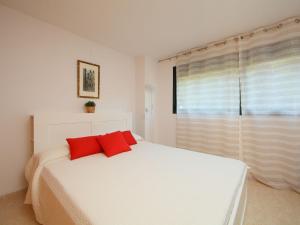 A bed or beds in a room at Holiday Home Vistamar by Interhome