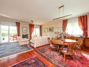 a living room with a table and a couch at Villa Villa Bertoni in Reus