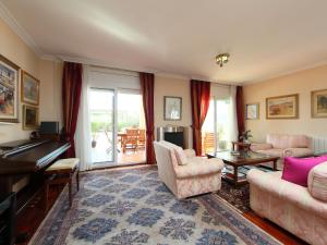 a living room filled with furniture and a piano at Villa Bertoni Golf & Sea by Interhome in Reus