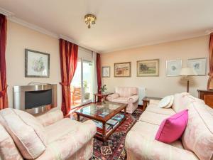 a living room with two couches and a tv at Villa Bertoni Golf & Sea by Interhome in Reus +36 photos