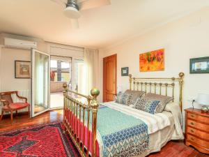 a bedroom with a bed and a sliding glass door at Villa Bertoni Golf & Sea by Interhome in Reus