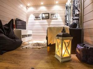 a living room with a dog laying on the floor at Holiday Home Oppas lapland levi by Interhome in Levi