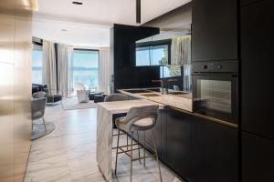 A kitchen or kitchenette at Posh Residence Luxury Suites