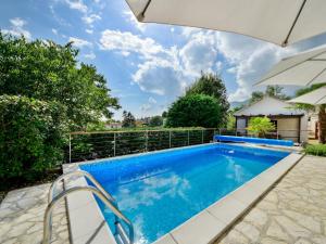 an image of a swimming pool in a house at Holiday Home Lucija by Interhome in Matulji