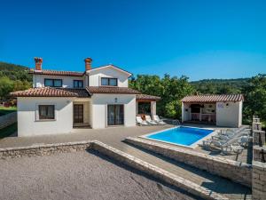 an image of a villa with a swimming pool at Holiday Home Dorijano by Interhome in Ripenda Kras
