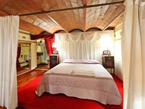 a bedroom with a large bed with a wooden ceiling at Apartment Plaza de Catalunya - Pso- de Gracia by Interhome in Barcelona