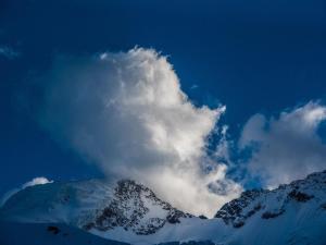 a cloud above a snow covered mountain at Apartment Schtraffel by Interhome in Saas-Fee