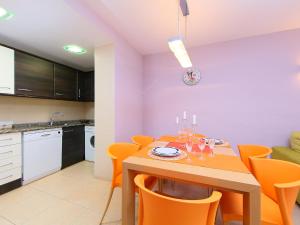 a kitchen and dining room with a table and chairs at Apartment Can Pavet by Interhome in Vilafortuny