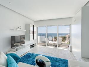 a living room with a view of the ocean at Studio Dream View 50m from the beach by Interhome in Albufeira