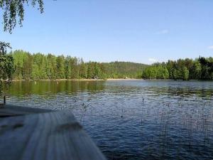 a view of a lake with trees in the background at Holiday Home Hannala by Interhome in Muurame