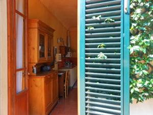 A kitchen or kitchenette at Poggio Imperiale Apartments