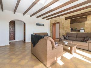 a living room with a couch and a table at Apartment Pla by Interhome in Jávea