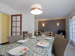 a dining room with a table and chairs at Holiday Home Tal Mor by Interhome in Quiberon