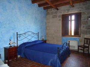 Кровать или кровати в номере Masseria Campierti