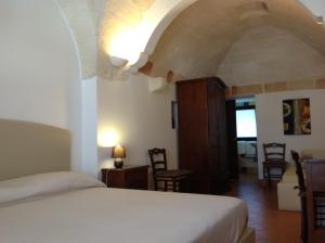 Postel nebo postele na pokoji v ubytování Masseria La Porticella