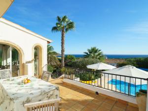 a patio with a table and a view of the ocean at Holiday Home Las Boyas by Interhome in Moraira