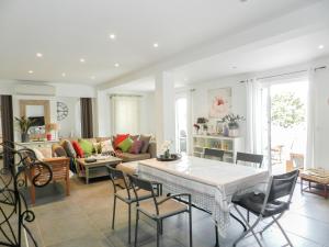 a living room with a table and chairs at Villa Fidiamare by Interhome in Galeria +27 photos