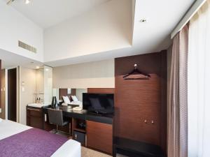 a hotel room with a bed and a desk at HOTEL MYSTAYS Shimizu in Shizuoka +36 photos