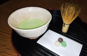 
a bowl of food sitting on top of a table at Minshuku Kaikazari Kunnui in Oshamambe
