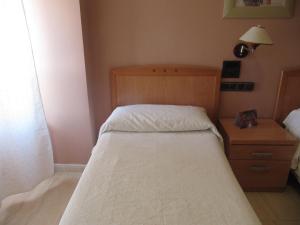 Postel nebo postele na pokoji v ubytování Hostal Meseguer