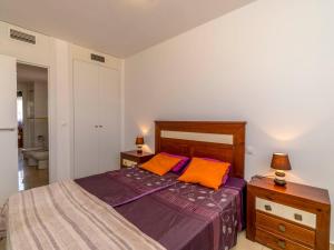 A bed or beds in a room at Apartment El Bosque by Interhome