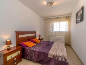 A bed or beds in a room at Apartment El Bosque by Interhome