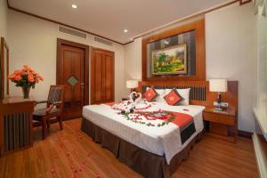Voodi või voodid majutusasutuse Hanoi Larosa Hotel toas