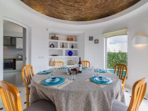 a dining room with a table with blue dishes on it at Villa Arribas Villa by Interhome in Patroves +17 photos