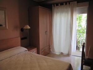 Postel nebo postele na pokoji v ubytování Hostal Meseguer