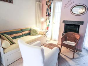 a living room with a couch and a fireplace at Holiday Home Carlotta by Interhome in Soviore