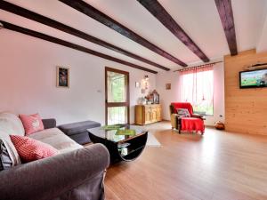 a living room with a couch and a table at Holiday Home Božica by Interhome in Brod na Kupi